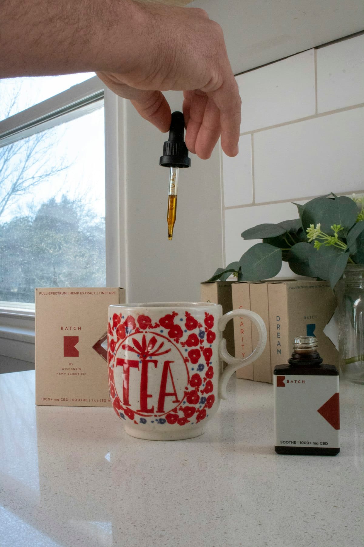 Glass dropper bottle with herbal tincture — supplement tincture format